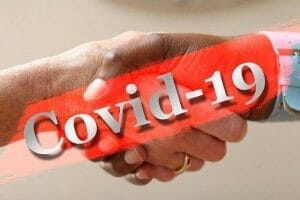 Image of shaking hands with words "COVID-19"
